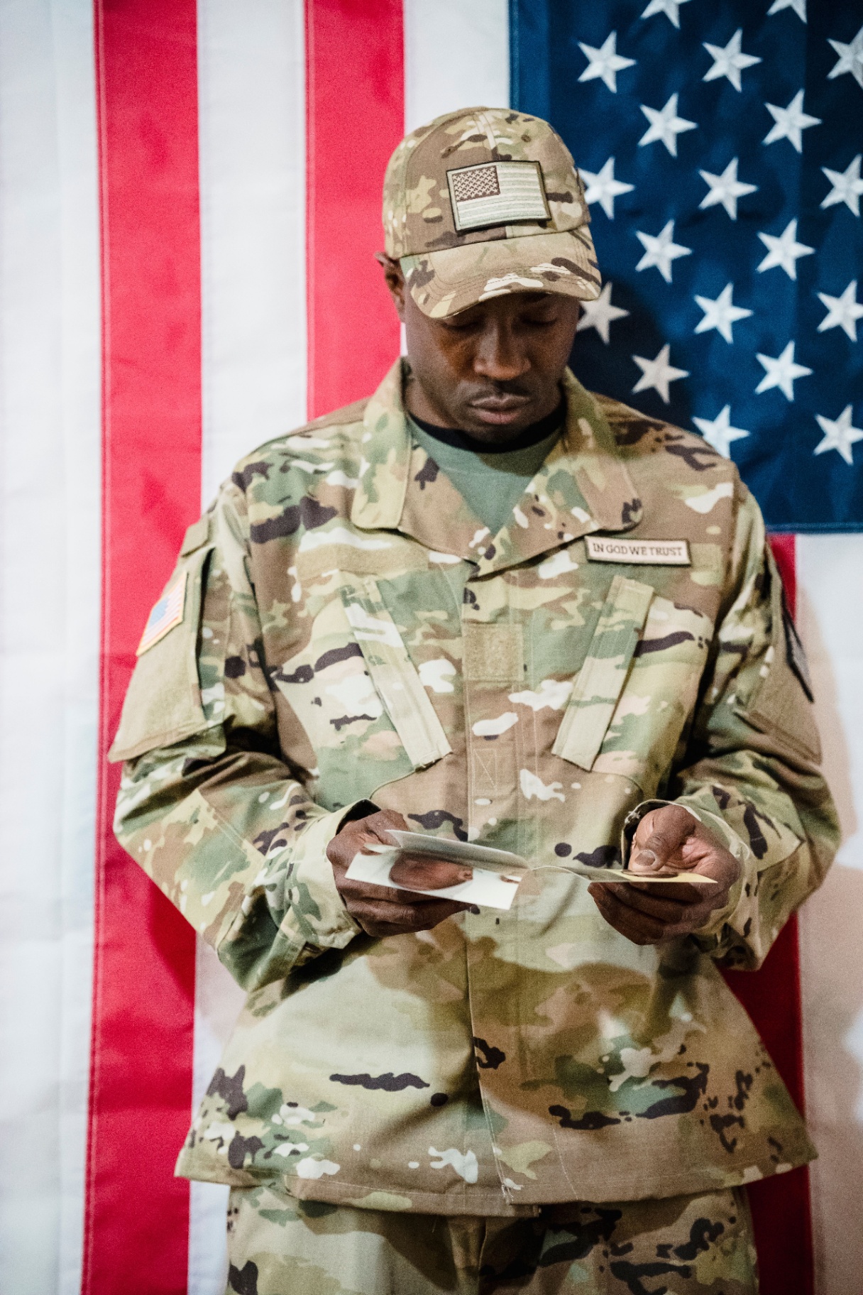 Veteran reading a VA claim letter at a kitchen table