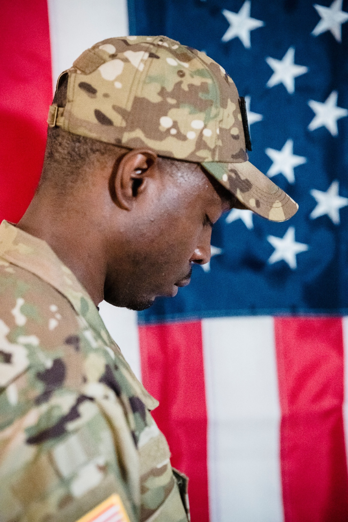 Veteran holding a folded American flag