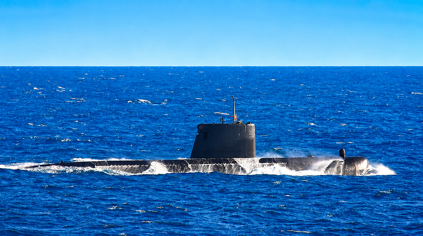 A submarine running on the surface in open ocean