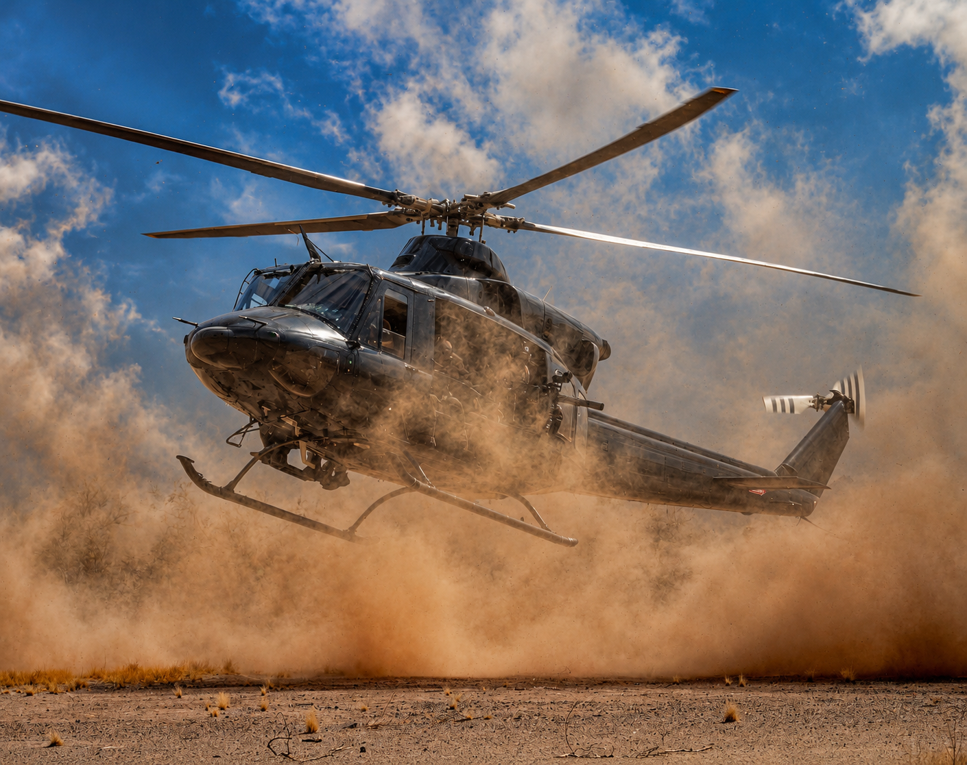 A military helicopter lifting off in a cloud of dust